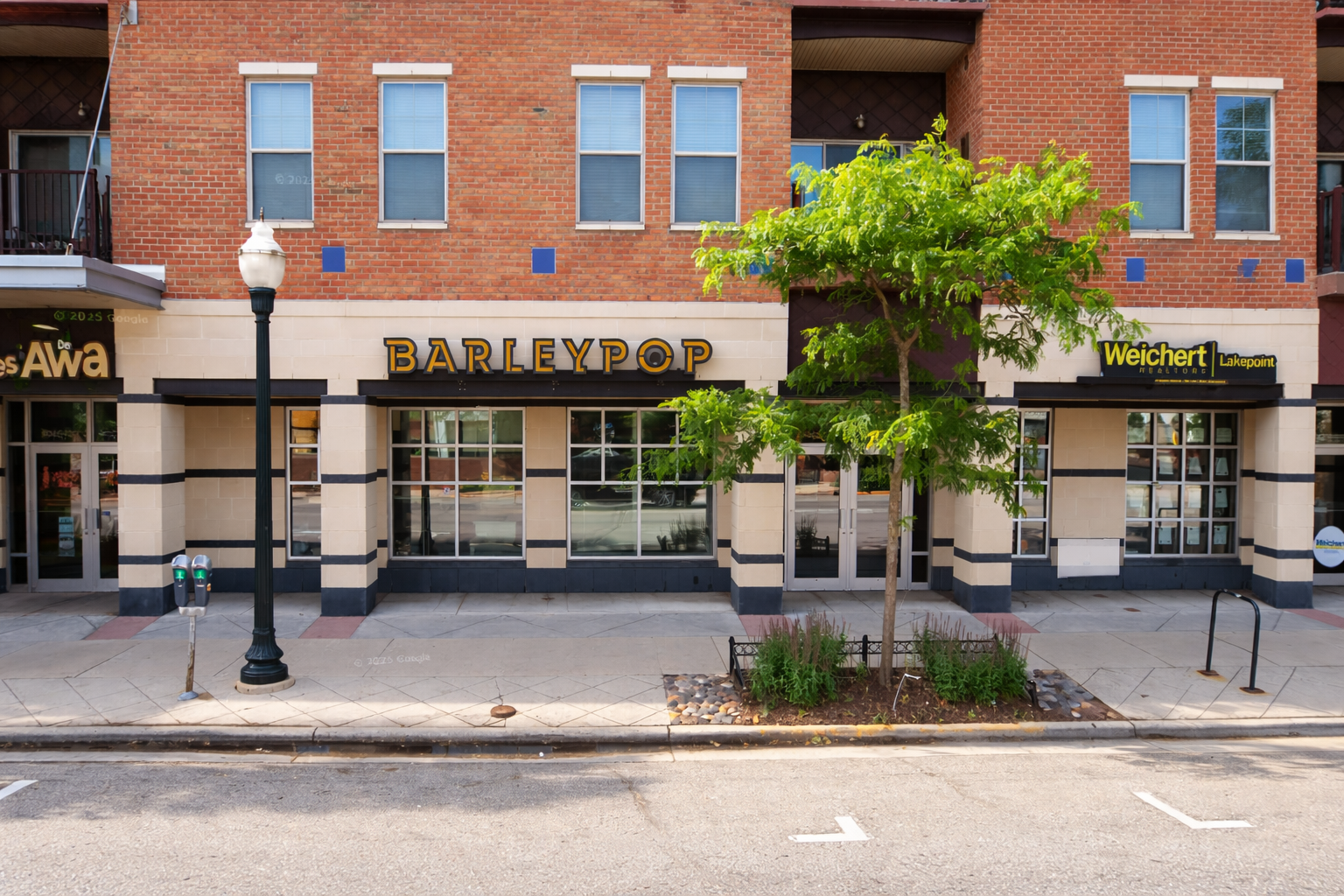Modern streetscape with vibrant storefronts.png
